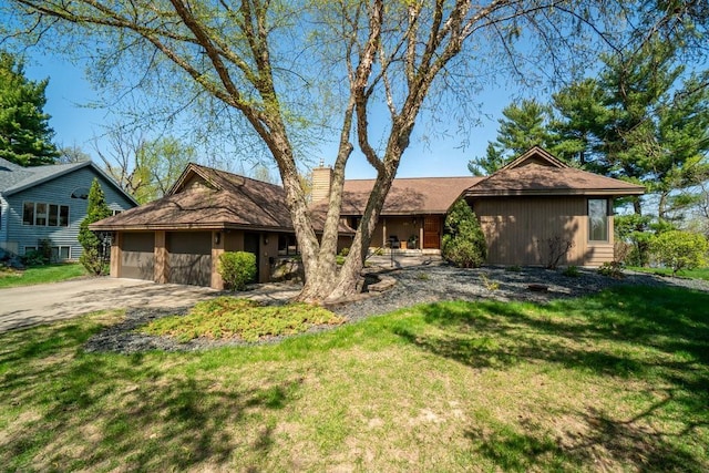 519 Grandview Heights Ct, Menomonie, WI 54751 - view of front of home with a chimney, an attached garage, a front lawn, and driveway