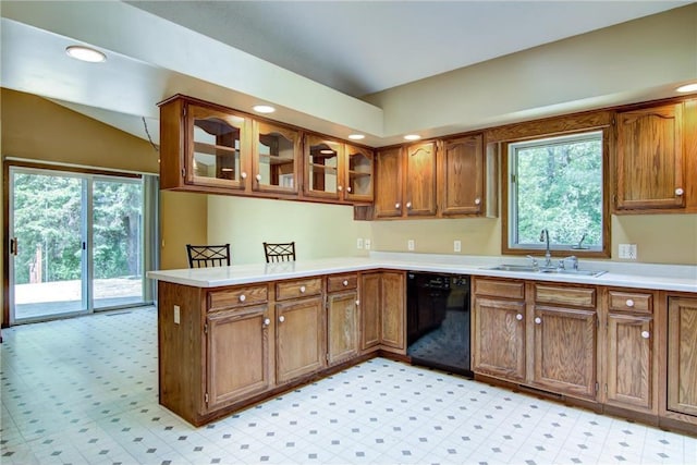 1286 Krattley Ln, Hudson, WI 54016 - kitchen with a sink, dishwasher, a peninsula, vaulted ceiling, and brown cabinetry