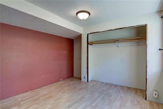 1286 Krattley Ln, Hudson, WI 54016 - unfurnished bedroom featuring wood finished floors and a closet
