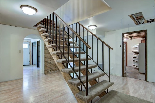 1286 Krattley Ln, Hudson, WI 54016 - stairway featuring arched walkways and wood finished floors