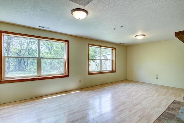 1286 Krattley Ln, Hudson, WI 54016 - empty room featuring a textured ceiling and wood finished floors