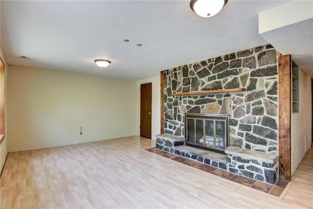 1286 Krattley Ln, Hudson, WI 54016 - unfurnished living room featuring wood finished floors and a fireplace