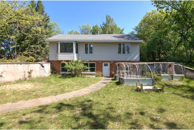 1286 Krattley Ln, Hudson, WI 54016 - view of front facade with a vegetable garden and a front lawn