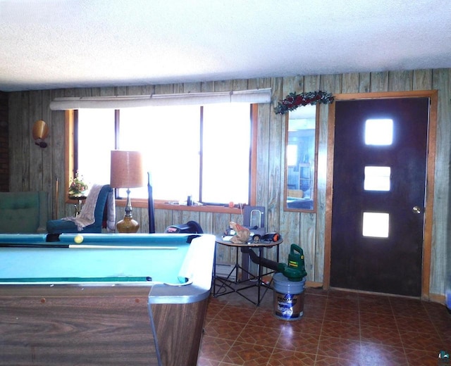 8305 Half Moon Dr, Iron River, WI 54847 - foyer featuring a textured ceiling, billiards table, and wood walls