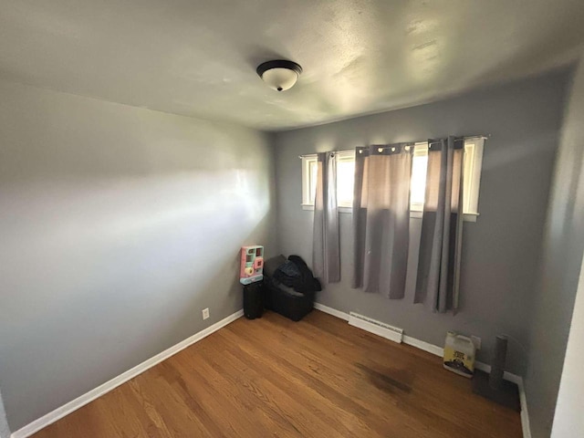 8210 W Winfield Ave, Milwaukee, WI 53218 - spare room with wood finished floors and baseboards