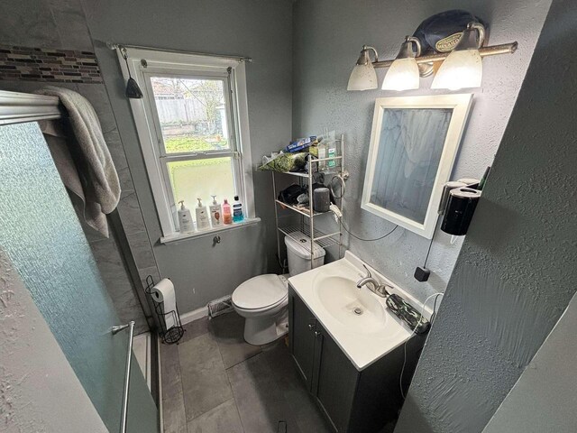8210 W Winfield Ave, Milwaukee, WI 53218 - bathroom with toilet, vanity, and a shower