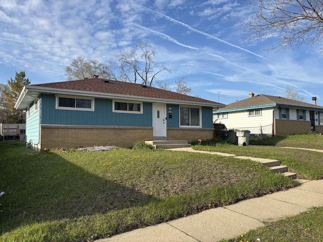 8210 W Winfield Ave, Milwaukee, WI 53218 - view of front of property with brick siding, entry steps, and a front lawn