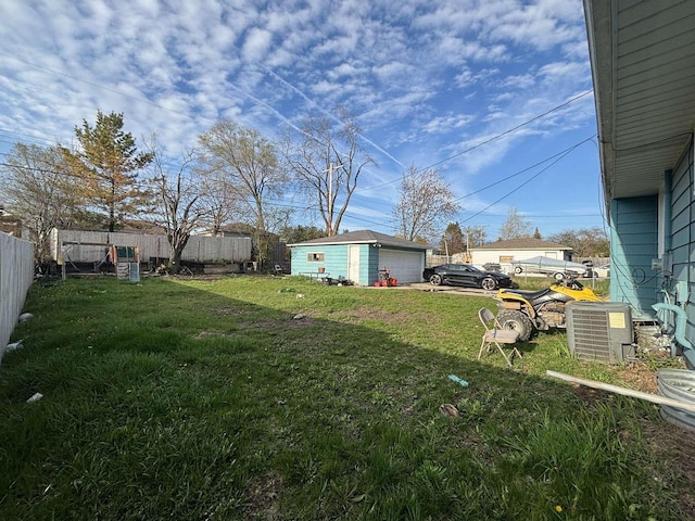 8210 W Winfield Ave, Milwaukee, WI 53218 - view of yard featuring central air condition unit and a garage