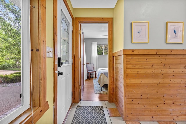 N5101 Hemlock St, Poynette, WI 53955 - entryway with light tile patterned flooring and wood walls