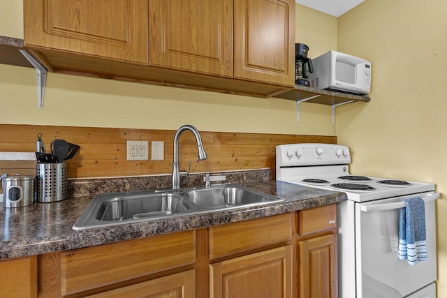 N5101 Hemlock St, Poynette, WI 53955 - kitchen with white appliances, a sink, and dark countertops