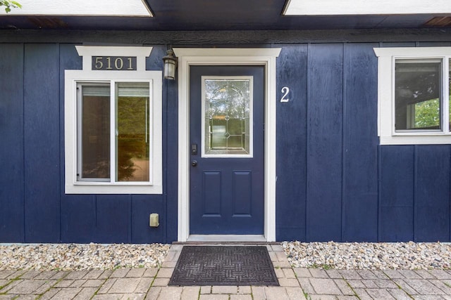 N5101 Hemlock St, Poynette, WI 53955 - doorway to property featuring board and batten siding