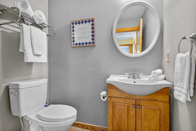 N5101 Hemlock St, Poynette, WI 53955 - half bathroom with toilet, vanity, and baseboards