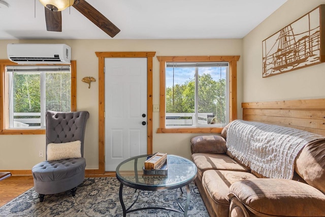 N5101 Hemlock St, Poynette, WI 53955 - living area with a wall mounted AC, healthy amount of natural light, wood finished floors, and ceiling fan
