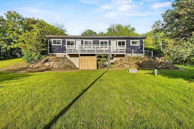 N5101 Hemlock St, Poynette, WI 53955 - view of front of property with a wooden deck and a front lawn