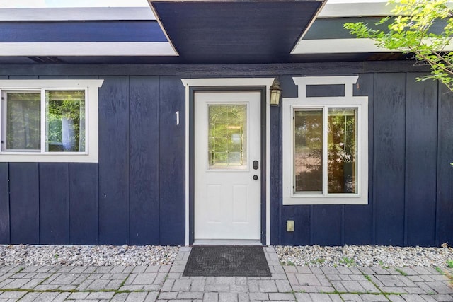 N5101 Hemlock St, Poynette, WI 53955 - doorway to property with board and batten siding