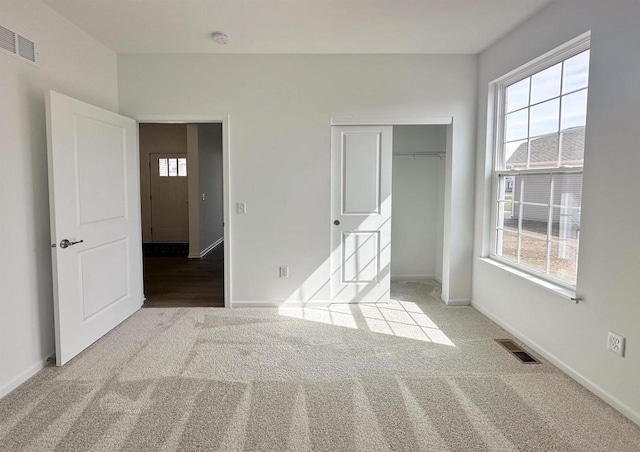 2833 Jackson St, Stoughton, WI 53589 - unfurnished bedroom featuring carpet floors, a closet, and baseboards
