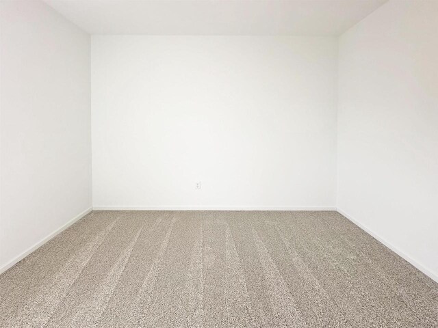 2833 Jackson St, Stoughton, WI 53589 - spare room featuring carpet flooring and baseboards