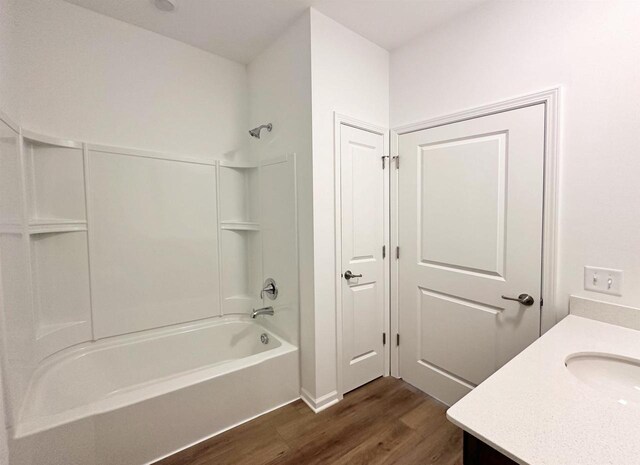 2833 Jackson St, Stoughton, WI 53589 - bathroom featuring wood finished floors, shower / bath combination, and vanity