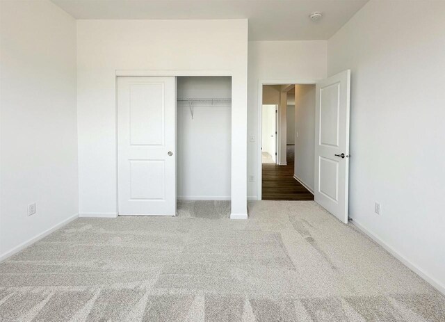 2833 Jackson St, Stoughton, WI 53589 - unfurnished bedroom featuring carpet floors, a closet, and baseboards