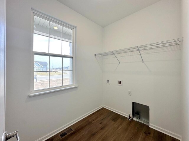 2833 Jackson St, Stoughton, WI 53589 - washroom with dark wood-style flooring, hookup for a washing machine, and baseboards