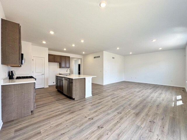 2833 Jackson St, Stoughton, WI 53589 - kitchen with a sink, dishwasher, recessed lighting, range with gas cooktop, and light countertops