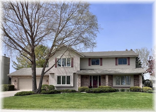 1012 Silent Sunday Ct, Racine, WI 53402 - traditional home with concrete driveway, an attached garage, a front lawn, and brick siding