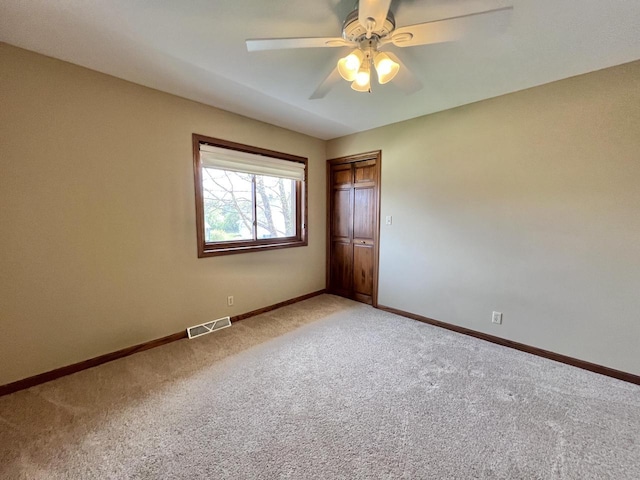 1012 Silent Sunday Ct, Racine, WI 53402 - unfurnished bedroom featuring light colored carpet, baseboards, and a closet