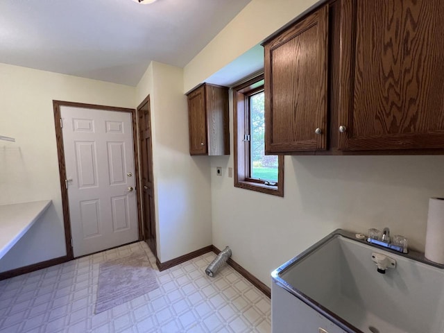 1012 Silent Sunday Ct, Racine, WI 53402 - washroom with cabinet space, light flooring, hookup for an electric dryer, and baseboards