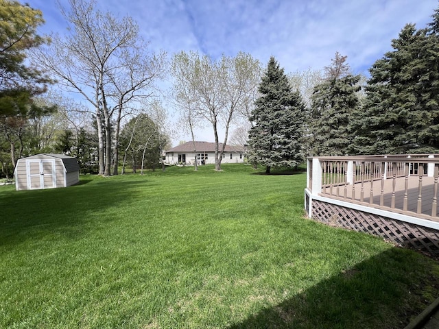 1012 Silent Sunday Ct, Racine, WI 53402 - view of grassy yard featuring a shed, an outdoor structure, and a wooden deck