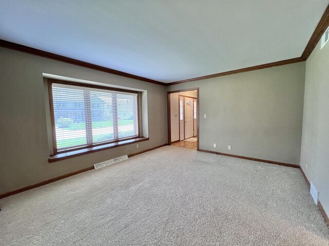 1012 Silent Sunday Ct, Racine, WI 53402 - carpeted empty room featuring crown molding and baseboards