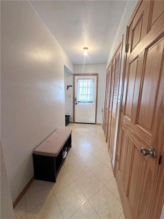 806 W Elm St, Chippewa Falls, WI 54729 - entryway featuring baseboards and light tile patterned flooring