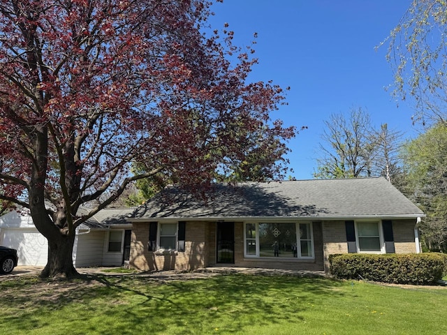 6043 N 118th St, Milwaukee, WI 53225 - ranch-style home with a front lawn, brick siding, and roof with shingles