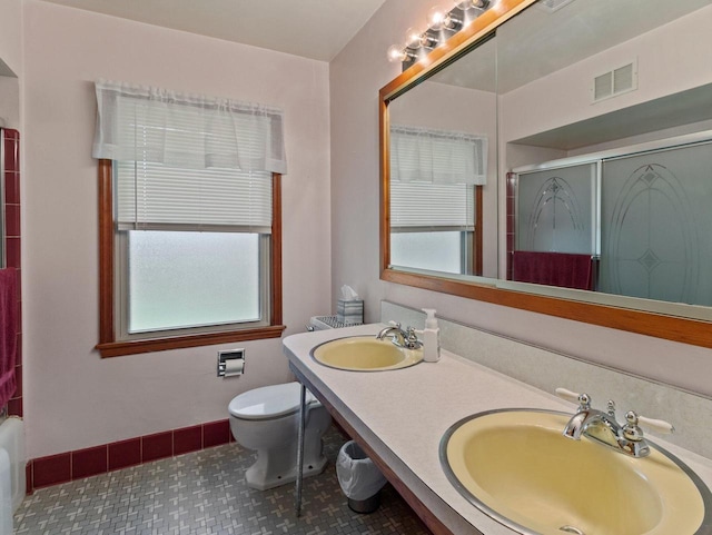 6043 N 118th St, Milwaukee, WI 53225 - full bath featuring toilet, tile patterned flooring, double vanity, and baseboards