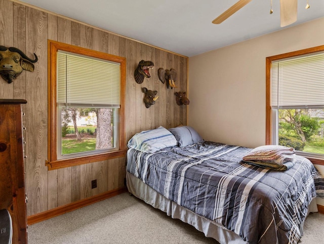 6043 N 118th St, Milwaukee, WI 53225 - bedroom with wood walls, carpet flooring, ceiling fan, and baseboards