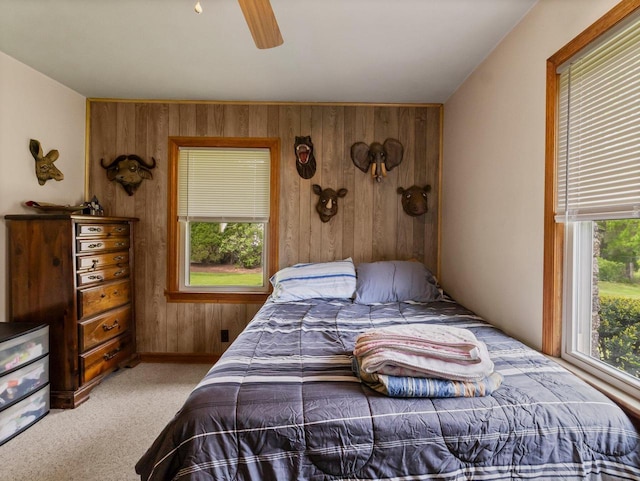 6043 N 118th St, Milwaukee, WI 53225 - carpeted bedroom featuring wood walls and a ceiling fan