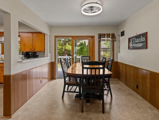 6043 N 118th St, Milwaukee, WI 53225 - dining room with wooden walls and a wainscoted wall