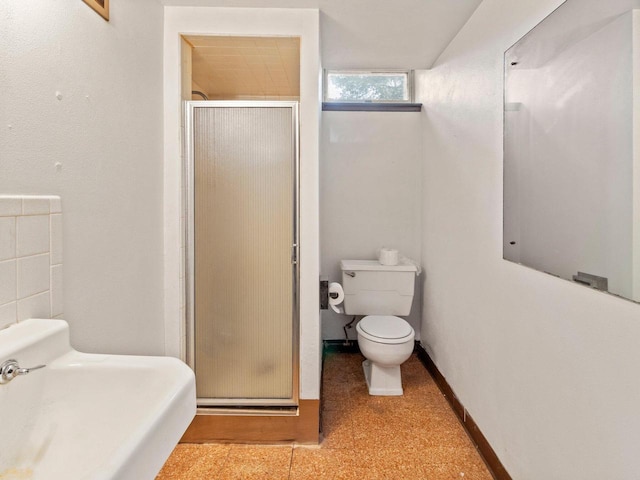 6043 N 118th St, Milwaukee, WI 53225 - bathroom featuring a shower stall, toilet, and tile patterned floors