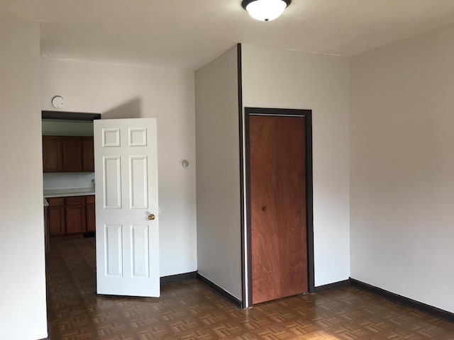 6121 12th Ave, Kenosha, WI 53143 - unfurnished bedroom with baseboards and a closet