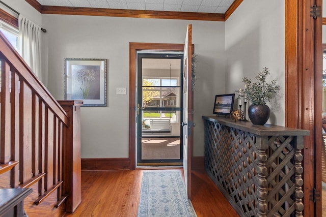 61 N Grand St, Markesan, WI 53946 - entryway featuring ornamental molding, wood finished floors, baseboards, and stairs