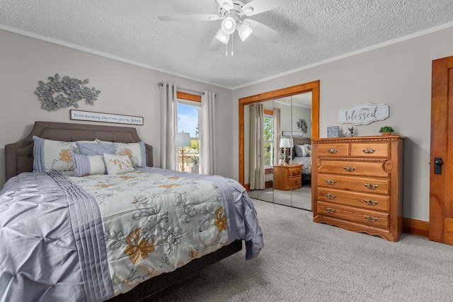 61 N Grand St, Markesan, WI 53946 - bedroom with light colored carpet, a textured ceiling, a closet, ornamental molding, and a ceiling fan