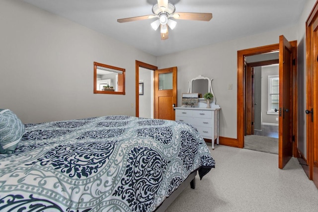 61 N Grand St, Markesan, WI 53946 - bedroom featuring light colored carpet, baseboards, and ceiling fan