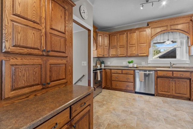 61 N Grand St, Markesan, WI 53946 - kitchen featuring stainless steel appliances, brown cabinetry, a sink, and crown molding