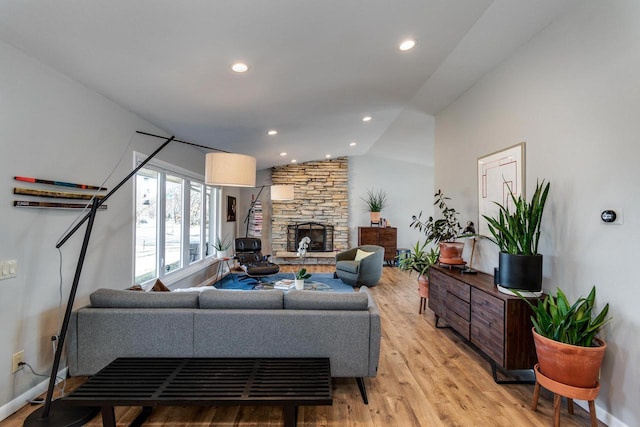 5402 Comanche Way, Madison, WI 53704 - living room with light wood-type flooring, lofted ceiling, baseboards, and recessed lighting
