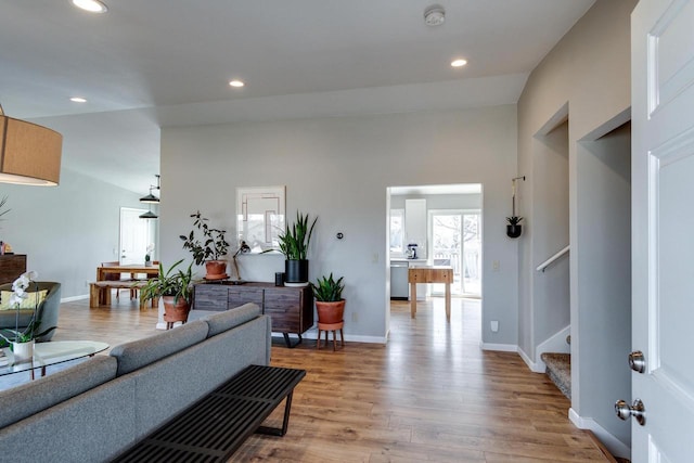 5402 Comanche Way, Madison, WI 53704 - living room featuring recessed lighting, light wood finished floors, stairs, and baseboards