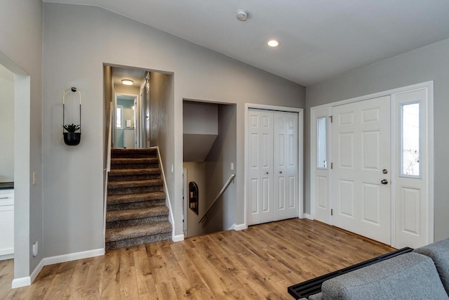 5402 Comanche Way, Madison, WI 53704 - foyer with lofted ceiling, light wood finished floors, baseboards, and stairway