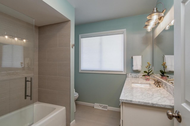 5402 Comanche Way, Madison, WI 53704 - bathroom featuring tile patterned floors, vanity, toilet, baseboards, and  shower combination