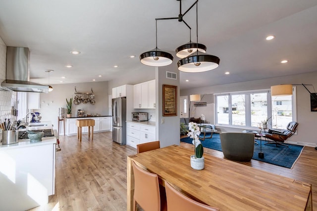 5402 Comanche Way, Madison, WI 53704 - dining area featuring light wood-style floors and recessed lighting