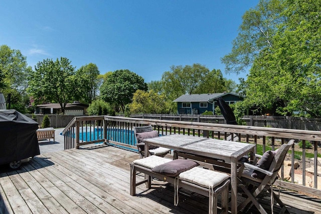 5402 Comanche Way, Madison, WI 53704 - wooden terrace featuring outdoor dining area, a fenced backyard, and area for grilling