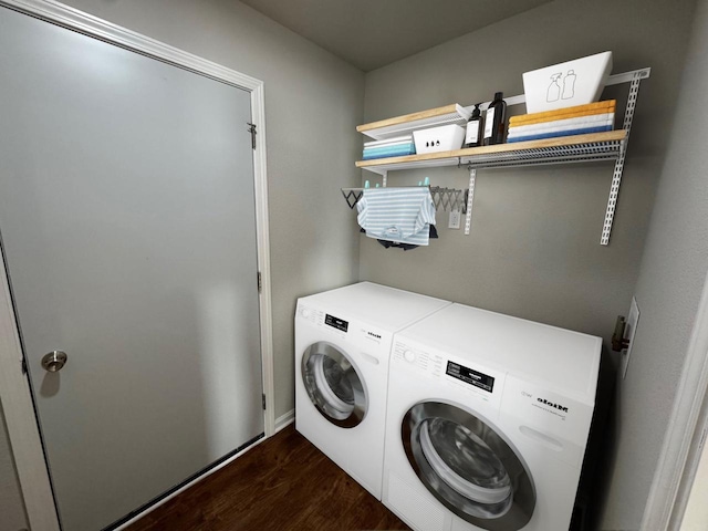 708 E Maple Beach Dr, Edgerton, WI 53534 - clothes washing area with washer and clothes dryer and dark wood finished floors