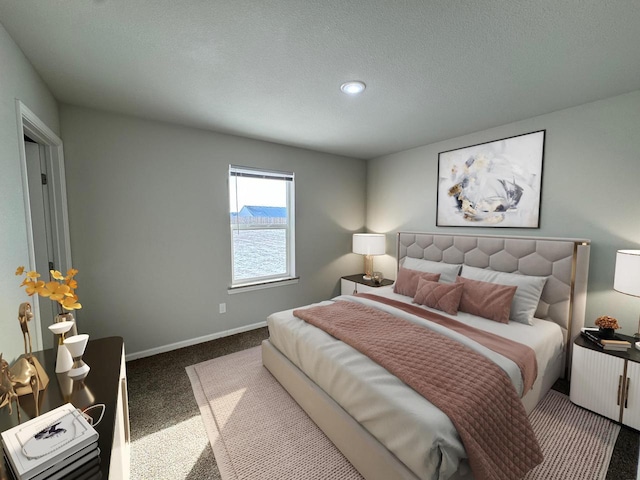 708 E Maple Beach Dr, Edgerton, WI 53534 - carpeted bedroom featuring baseboards and a textured ceiling
